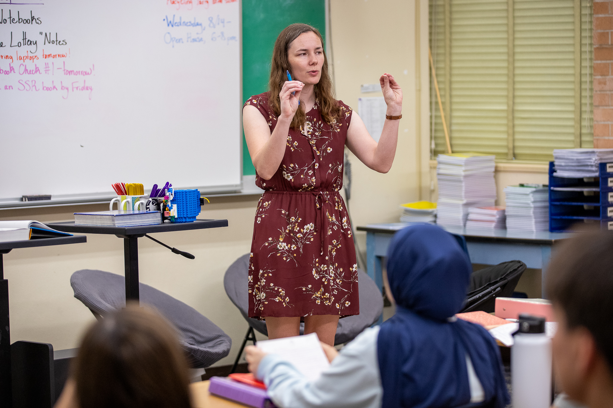 A teacher addresses her class