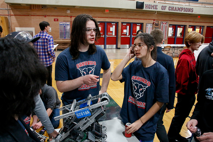 A robotics team discusses their next move