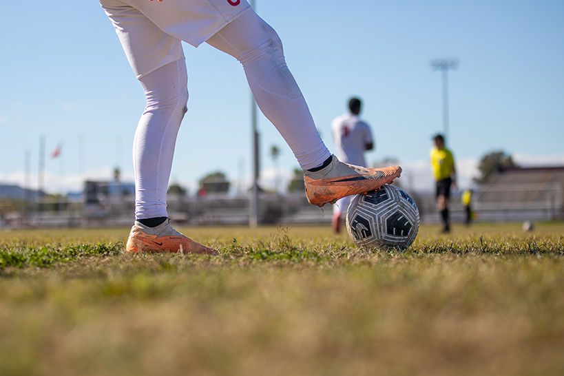 A closeup of a Sahuaro player's foot on the soccer ball
